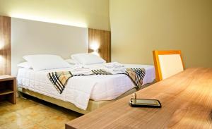 Ένα ή περισσότερα κρεβάτια σε δωμάτιο στο Albergo Papillon