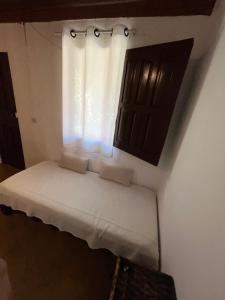 Postel nebo postele na pokoji v ubytování Caju com Mel