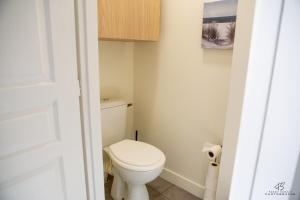 a bathroom with a white toilet in a room at CASA LEIA - À 4 min de la plage, avec Wifi in Sainte-Marie-la-Mer +23 photos