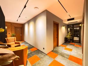 an office lobby with an orange and white floor at Tsalamuri Old Tbilisi in Tbilisi City