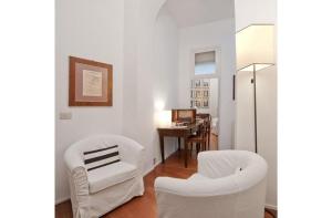 a living room filled with furniture and a white couch at B&B Colori di Roma in Rome