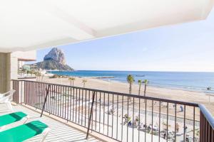 a balcony with a view of the beach at RIURAU HOME 1ª línea Calpe-Playa II in Calpe