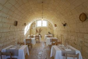 Ein Restaurant oder anderes Speiselokal in der Unterkunft Masseria Rauccio 