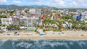 an aerial view of a beach with people and buildings at Madison - 99 Steps to Beach in Golden Zone in Bucerías