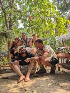 a group of people are posing for a picture at Hostal Corazón de Tagua in Palomino