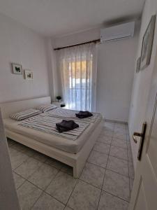 Ein Bett oder Betten in einem Zimmer der Unterkunft Cozy Sun