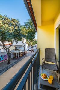 a plate of food on a table on a balcony at Old Town Charm Apartment in Albufeira