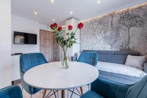 Posedenie v ubytovaní Gąsienica Apartamenty Queen