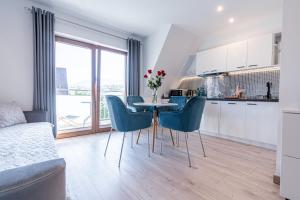 Kuchyňa alebo kuchynka v ubytovaní Gąsienica Apartamenty Queen