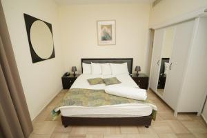 Postel nebo postele na pokoji v ubytování Hotel Blue Weiss