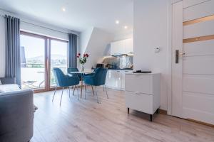 Posedenie v ubytovaní Gąsienica Apartamenty Queen