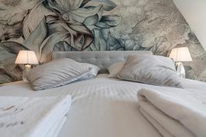 Posteľ alebo postele v izbe v ubytovaní Gąsienica Apartamenty Queen