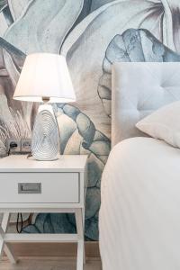 Posteľ alebo postele v izbe v ubytovaní Gąsienica Apartamenty Queen