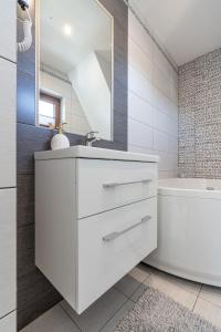 Kúpeľňa v ubytovaní Gąsienica Apartamenty Queen