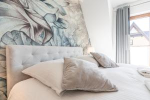 Posteľ alebo postele v izbe v ubytovaní Gąsienica Apartamenty Queen