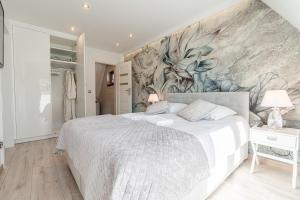 Posteľ alebo postele v izbe v ubytovaní Gąsienica Apartamenty Queen + 37 fotografií
