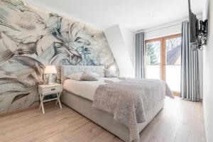 Posteľ alebo postele v izbe v ubytovaní Gąsienica Apartamenty Queen