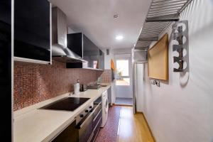 Kuchyň nebo kuchyňský kout v ubytování Apartament Alfaz del Pi