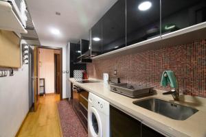 Kuchyň nebo kuchyňský kout v ubytování Apartament Alfaz del Pi