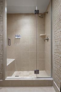 a shower with a glass door in a bathroom at Gaylord National Resort & Convention Center in National Harbor