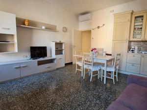 a kitchen and dining room with a table and chairs at Cairoli Home in Rapallo