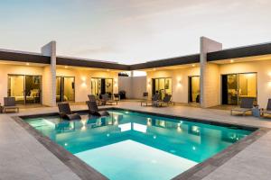 a swimming pool in the middle of a house at Romantic Escape, Walk to Beach, Pool, Hammock in Long Bay Hills