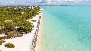 an aerial view of a beach in the ocean at Romantic Escape, Walk to Beach, Pool, Hammock in Long Bay Hills