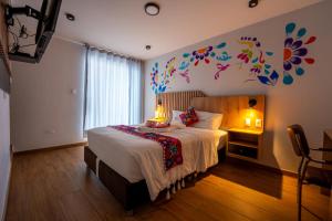 Postel nebo postele na pokoji v ubytování Platero Hotel