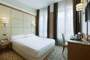 Postel nebo postele na pokoji v ubytování Hotel Teco
