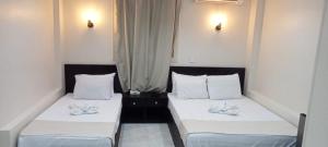 Postel nebo postele na pokoji v ubytování Ramses Pyramids INN + 10 fotografií