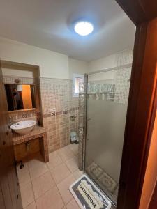 a bathroom with a shower and a sink at Villa Antaquira in Antequera +15 photos