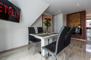 Posedenie v ubytovaní Gąsienica Apartamenty Queen