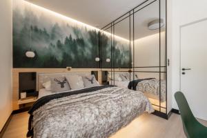 Posteľ alebo postele v izbe v ubytovaní ApartSerwis - Gorące Źródła Apartament Czerwone Wierchy