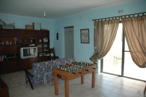 a living room with a couch and a table at 31 Memories in Pembroke