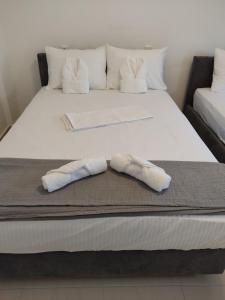 Postel nebo postele na pokoji v ubytování Akrotiri rooms