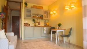 a kitchen with a table and a counter top at Casa Mia in Tremezzo