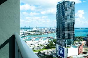 a view of a city with a tall skyscraper at NEW Suite Downtown Miami - Amazing view 27th floor in Miami