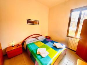 Posteľ alebo postele v izbe v ubytovaní Accogliente Appartamento vicino al Centro e alla Fiera