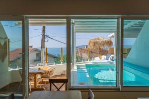 a view of a swimming pool from a house at Villa Kalimera in Balchik
