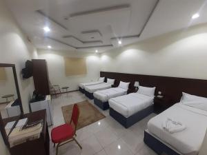 Ένα ή περισσότερα κρεβάτια σε δωμάτιο στο فندق ورد الششة - WRD Al Shisha Hotel