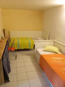 Postel nebo postele na pokoji v ubytování LA COLOMBE