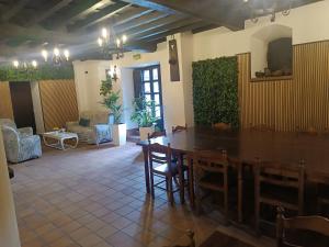 a dining room with a table and chairs in a room at LA CASONA DEL XERRON in El Condado
