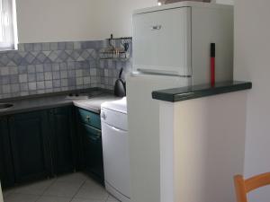 Kuchyňa alebo kuchynka v ubytovaní Vis a Vis Apartments