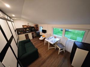 a small living room with a table and chairs at Ruridylle IV in Simmerath