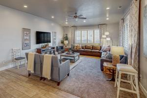 a living room with a couch and a tv at Red Mountain Paradise: Paradise Village #90 in Santa Clara