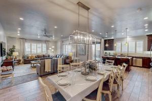 a dining room and living room with a table and chairs at Red Mountain Paradise: Paradise Village #90 in Santa Clara