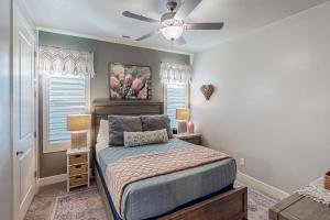 a bedroom with a bed and a ceiling fan at Red Mountain Paradise: Paradise Village #90 in Santa Clara +27 photos