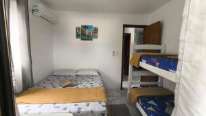 Postel nebo postele na pokoji v ubytování Casa de praia em Maria Farinha - Pe. + 14 fotografií