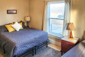 a bedroom with a bed and a window at South Dakota Hideaway Walk to Dtwn Redfield in Redfield