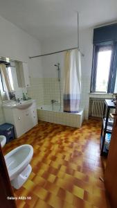a bathroom with a shower and a toilet and a sink at #Punto FM 5# in Campalto